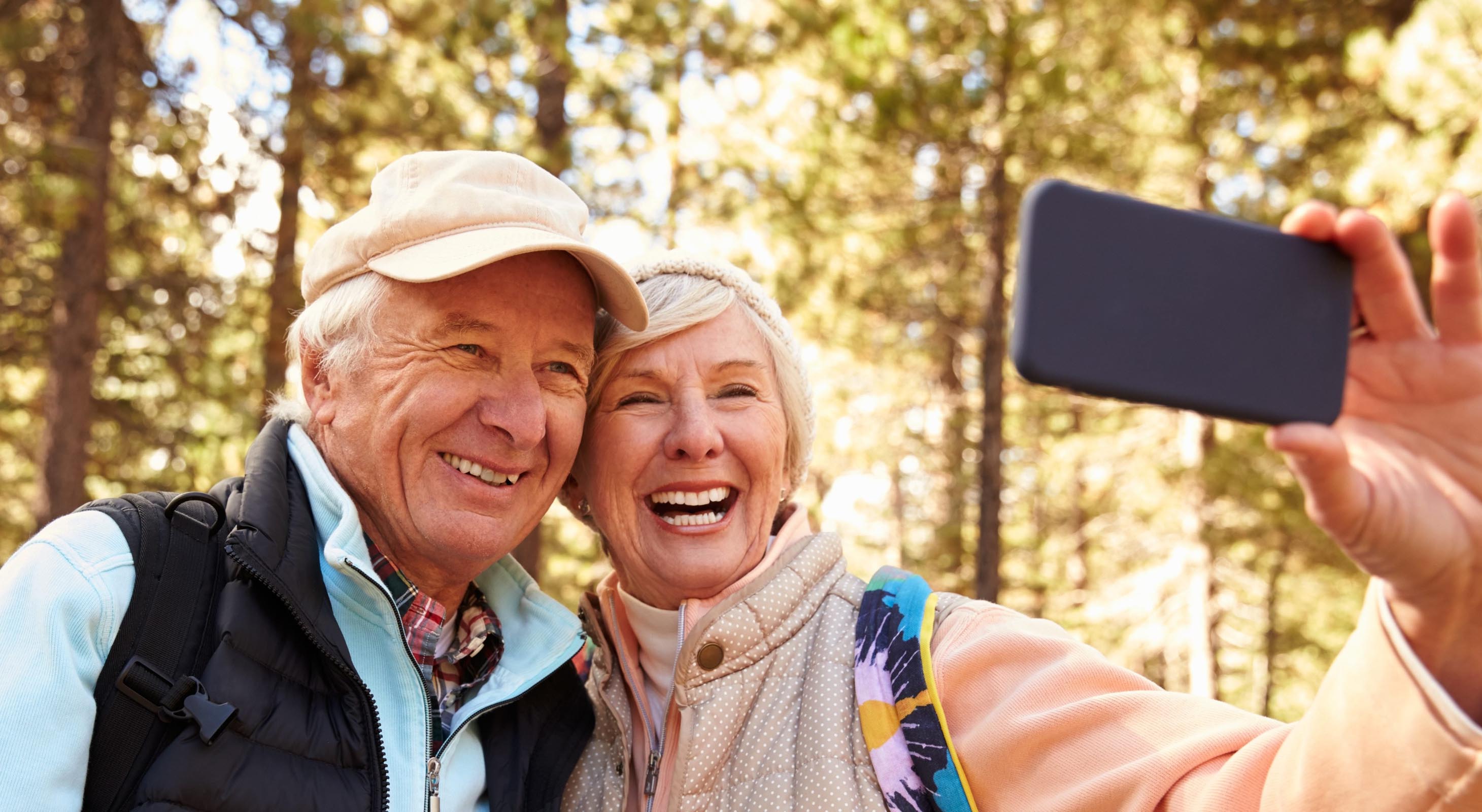Elderly couple smiling and taking a selfie